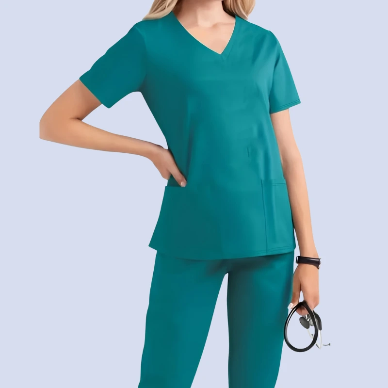 Woman wearing teal medical scrub top and matching pants